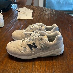 Basically brand new worn like twice. Never touched dirt or grass